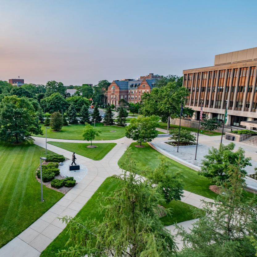 Trees and walkways in front of Hannah Administration building on MSU's campus